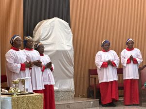 All female Mass Servers during Our Lord's Prayer at mass